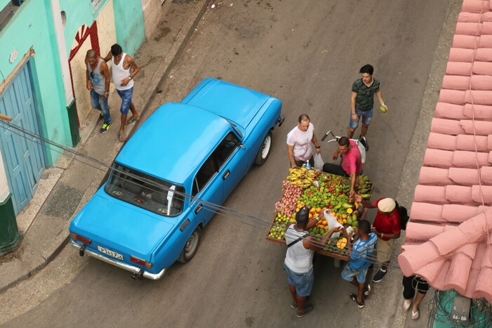 Cuban people buying fruit and veggies on the street